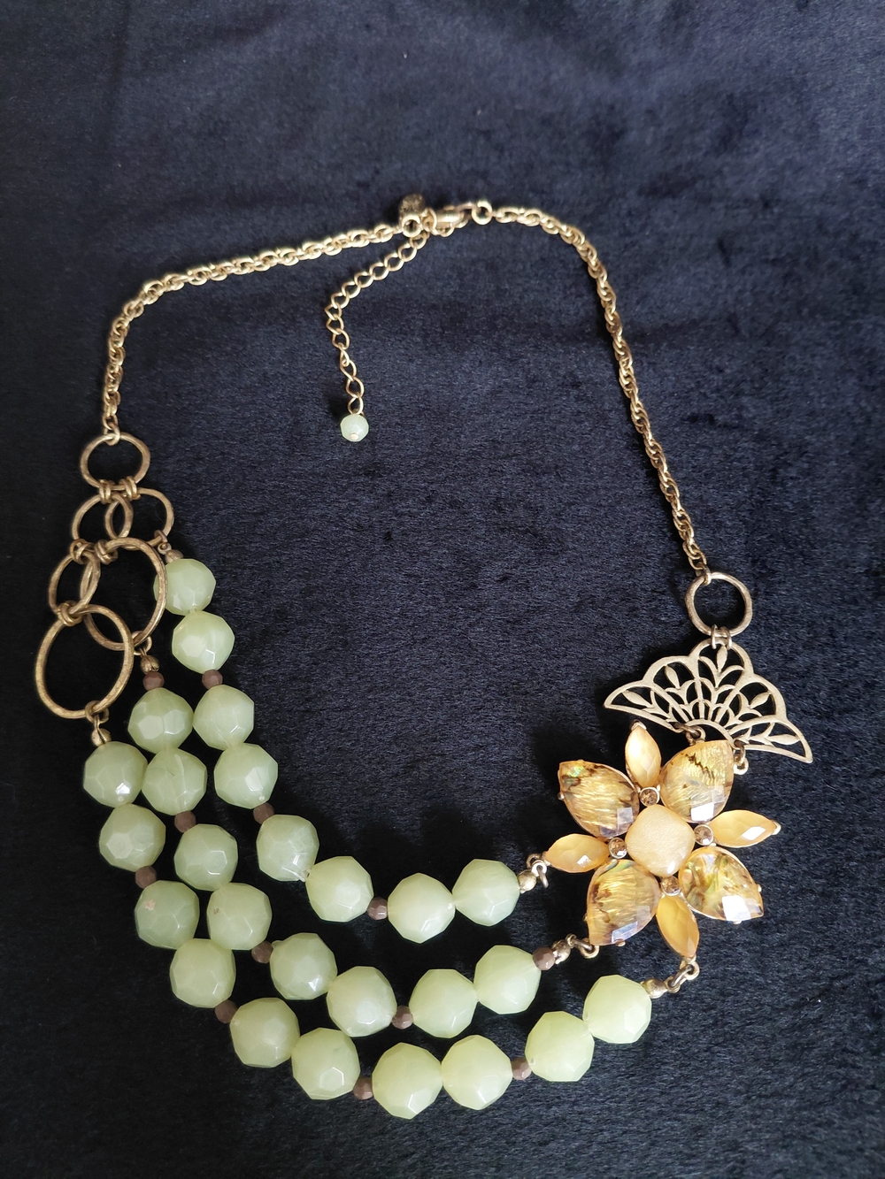 Gold-Tone Necklace with Pale Green Beads and Floral Accent